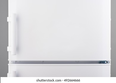 White Refrigerator On Gray Background