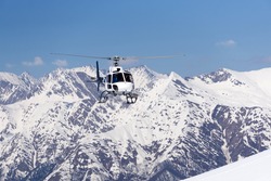 White Rescue Helicopter  In The Mountains