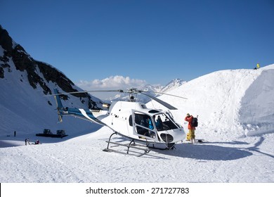 White Rescue Helicopter Parked In The Snowy Mountains