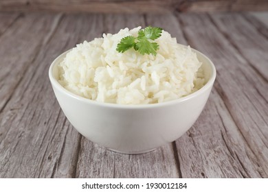 White Rice In Bowl On Wood Table