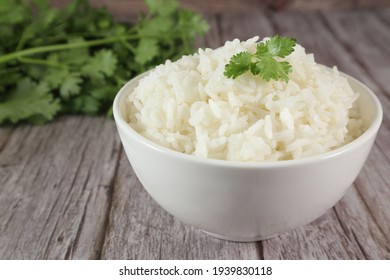 White Rice In Bowl On Wood Table