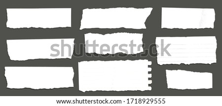 White ripped note, notebook paper stuck with sticky tape on black background.