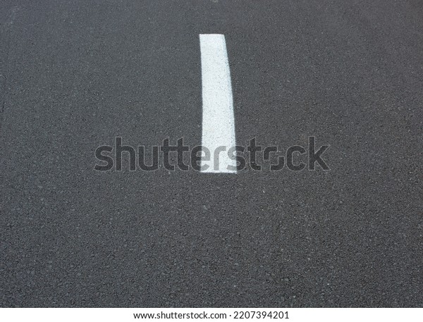 white\
road lines and empty asphalt road.space for\
text.