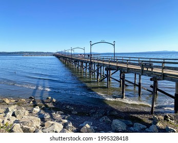 White Rock pier - the longest pier in Canada. View of pier and ocean in sunny day and clear sky.
