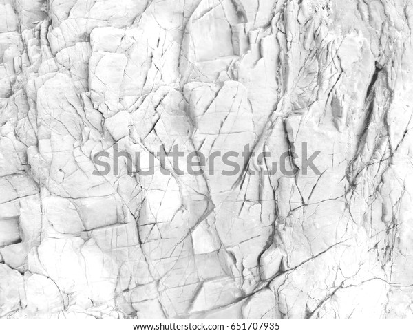 White rock wall.\
White background or texture.\
