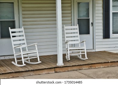 White Rocking Chairs On Front Porch.