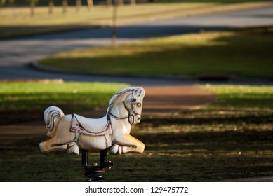 White Rocking Horse On The Playground.