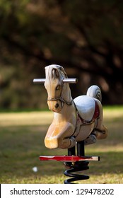 White Rocking Horse On The Playground.