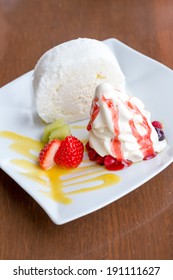 White Roll Cake With Icecream And Strawberries