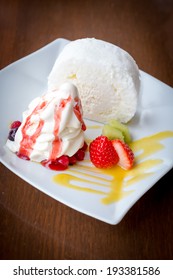 White Roll Cake With Icecream And Strawberries (dark Vignette)