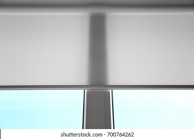 White Roller Blind On A Metal Plastic Window