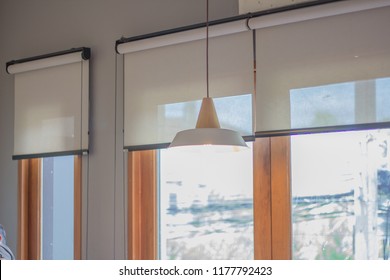 White Roller Blind And Window.