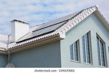 White roof house for energy saving. Close up on modern house energy efficiency white roof with solar water heating panels. White Roof Coatings.
 - Shutterstock ID 2190193001