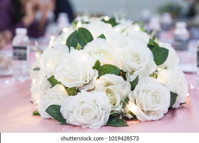 White Rose And Fairy Lights On The Pink Dining Table