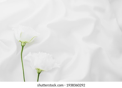 White Rose Flowers On Silk Fabric As Bridal Flatlay Background, Wedding Invitation And Holiday Branding, Flat Lay Design Concept