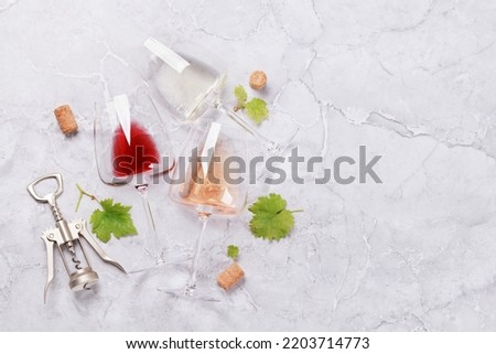 White, rose and red wine glasses. Flat lay with copy space