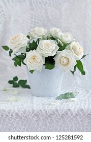 White Roses In A Ceramic Vase.