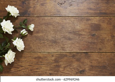 White Roses On Rustic Wood Background