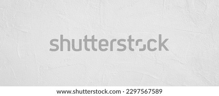 White rough grainy stone or plastered wall texture background