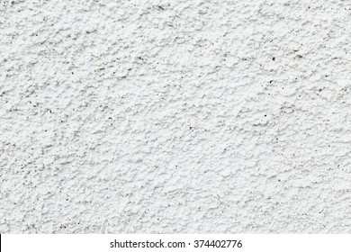 White rough texture of cement facade detail. background