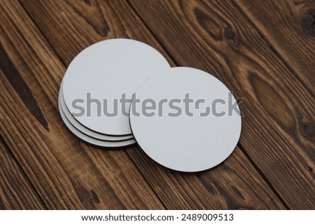 White round empty coasters Mockup on wooden background