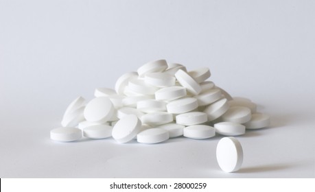 White Round Pill On The White Isolated Background