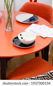 White Round Plate On A Round Red Table