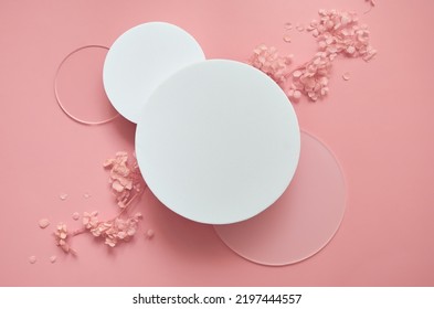 White round podium pedestal cosmetic beauty product presentation scene empty mockup on trendy pink coral pastel background with spring flowers, minimalist flat lay backdrop luxury template, top view. - Powered by Shutterstock