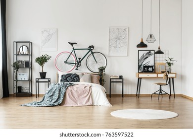 White Round Rug On The Floor In Bright Bedroom With Hipster Bike And Wooden Desk