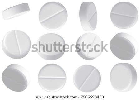 White round tablets on white background.