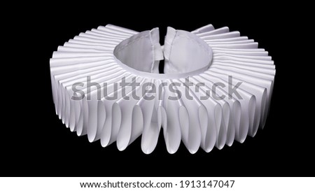 white ruff or ruffled or millstone collar isolated on black background - historic renaissance fashion