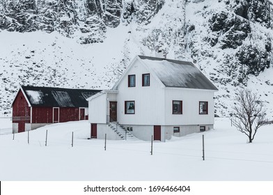 White Rural House With Fence In Winter Landscape, Norway.