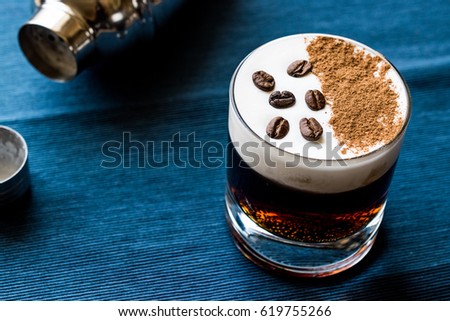 White Russian Cocktail with coffee beans.
