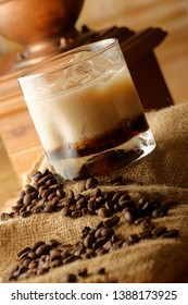 A White Russian is a cocktail made with vodka, coffee liqueur and cream served with ice in an Old Fashioned glass. Often milk or half and half will be used as an alternative to cream.