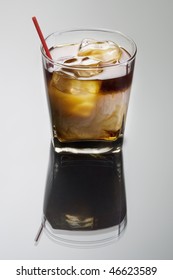 White Russian Mixed Drink On A Grey Background With Reflection