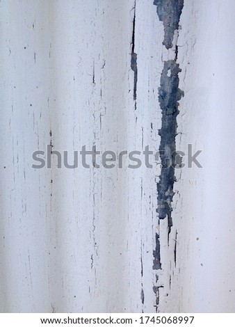 White rustic abstract design background chipped paint flaking corrogated metal sheet