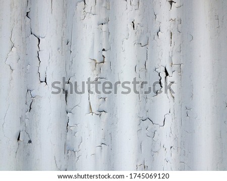 White rustic abstract design background chipped paint flaking corrogated metal sheet