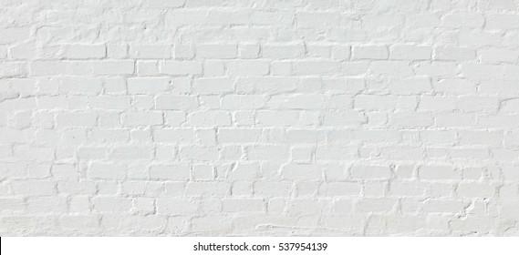 White Rustic Texture. Retro Whitewashed Old Brick Wall Surface. Vintage Structure. Grungy Shabby Uneven Painted Plaster. Whiten Facade Background. Abstract Web Banner.