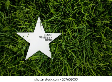 White Rustic Wooden Star On On The Grass With The Inspirational Funny Quote 