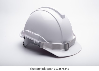 White safety helmet construction on white background