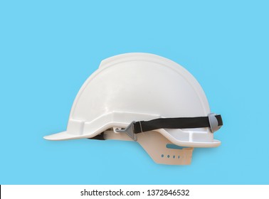 White safety helmet isolated on blue background with clipping path.