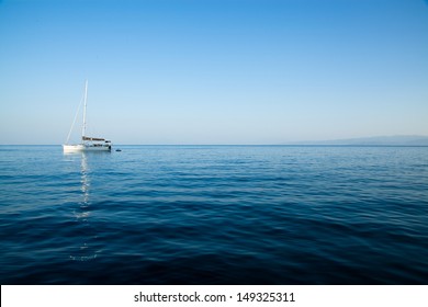 White sailing boat on calm waters