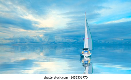 A white sailing yacht (boat) on the calm sea with storm clouds