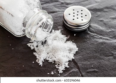 White salt on a black background
