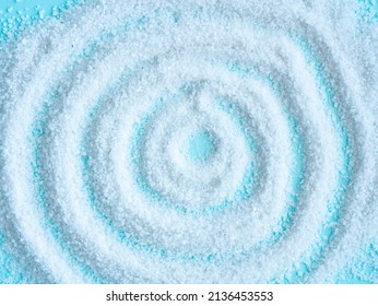 White salt is scattered in a circle on blue. Salt cave concept. background image - Shutterstock ID 2136453553