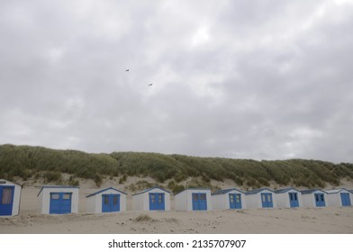White sand beach on Dutch island Texel,The Waddensea Netherlands, summer evening, dunes, beachhouses, beachpole