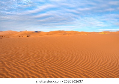 White sand dune shape clouds and blue sky - Sand dunes in the Sahara Desert, Merzouga, Morocco - Orange dunes in the desert of Morocco - Sahara desert, Morocco - Powered by Shutterstock