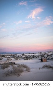 White Sand Dunes With A Pastel Sunset Background