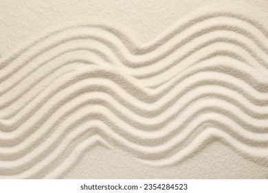White sand with pattern as background, top view. Zen concept