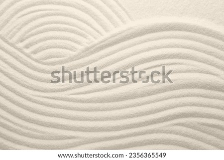 White sand with pattern as background, top view. Concept of zen and harmony